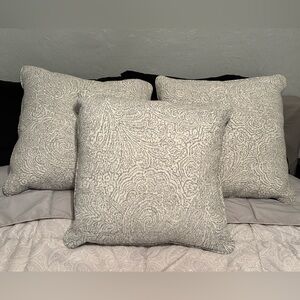 Three Gray Patterned Accent Pillows